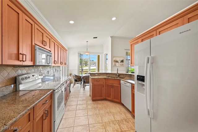 kitchen with brown cabinets, ornamental molding, a sink, backsplash, and white appliances