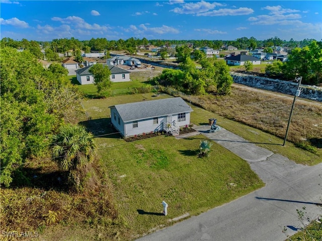 birds eye view of property with a residential view