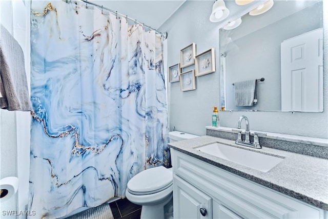 bathroom featuring vanity, toilet, and a shower with curtain