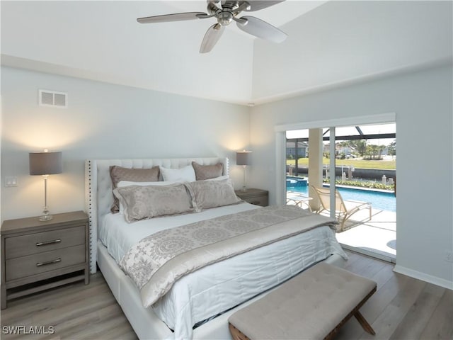 bedroom with visible vents, wood finished floors, access to exterior, and a ceiling fan