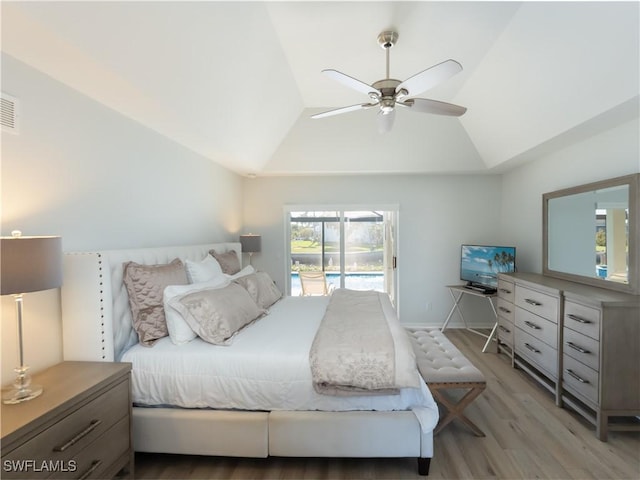 bedroom with access to exterior, light wood-style floors, baseboards, ceiling fan, and vaulted ceiling