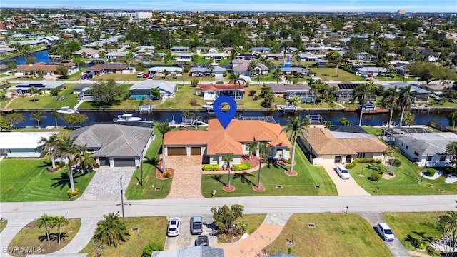 aerial view featuring a residential view and a water view