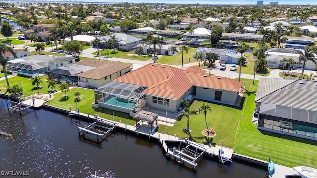 aerial view with a residential view and a water view