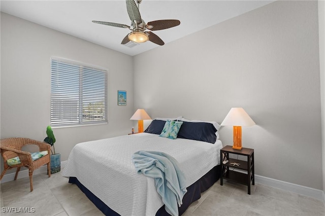 bedroom with tile patterned floors, visible vents, baseboards, and ceiling fan