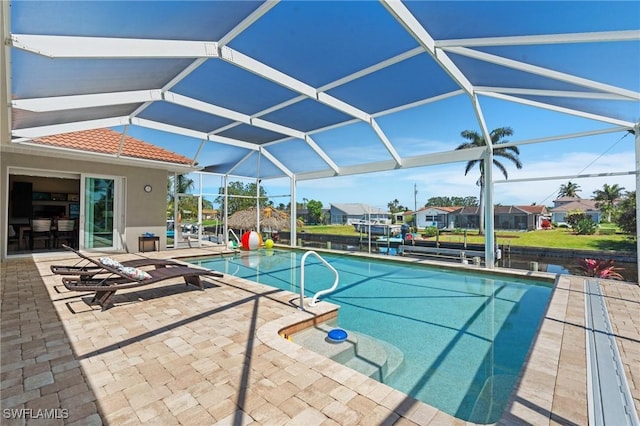 outdoor pool featuring a residential view, a patio, and a lanai