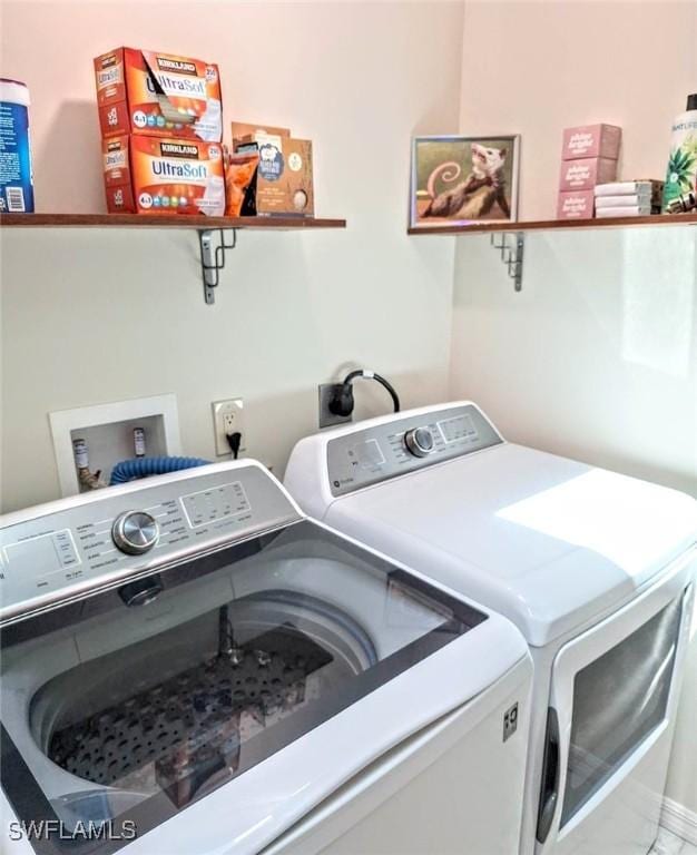 laundry room with separate washer and dryer and laundry area