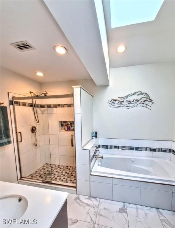 bathroom with recessed lighting, a tub with jets, a shower stall, marble finish floor, and visible vents