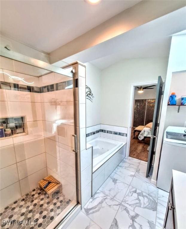 bathroom featuring a stall shower, marble finish floor, a bath, and connected bathroom