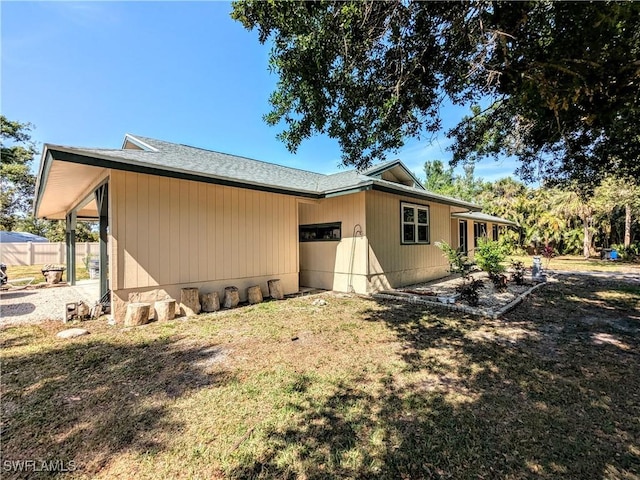 view of property exterior with a yard