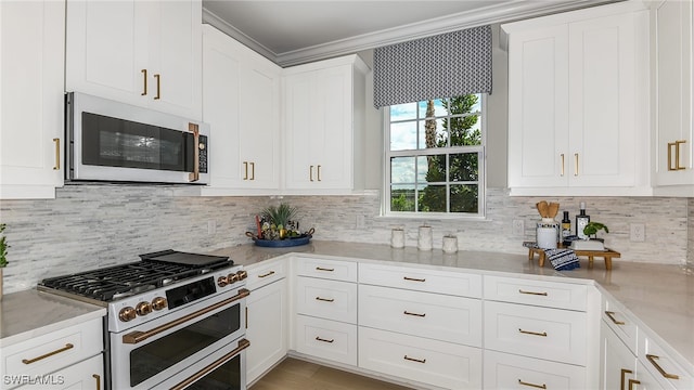 kitchen with tasteful backsplash, white appliances, white cabinetry, and ornamental molding