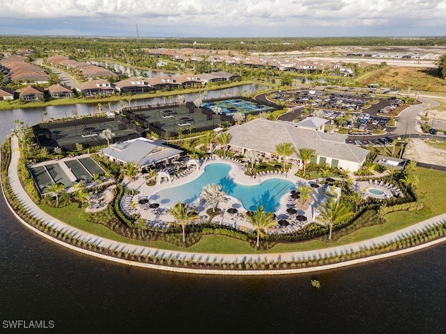 birds eye view of property featuring a water view and a residential view