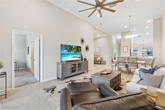 living area featuring baseboards, high vaulted ceiling, crown molding, and ceiling fan with notable chandelier