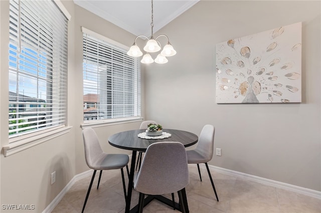 tiled dining space with a chandelier, a healthy amount of sunlight, baseboards, and vaulted ceiling