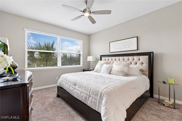 carpeted bedroom featuring a ceiling fan and baseboards