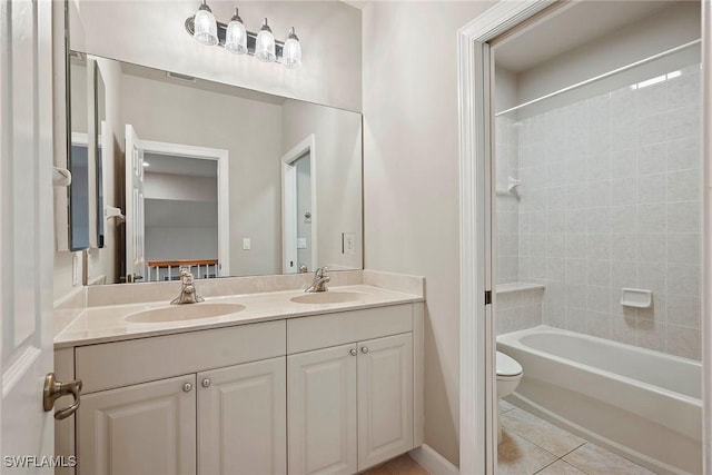 full bath featuring tile patterned flooring, double vanity, toilet, and a sink