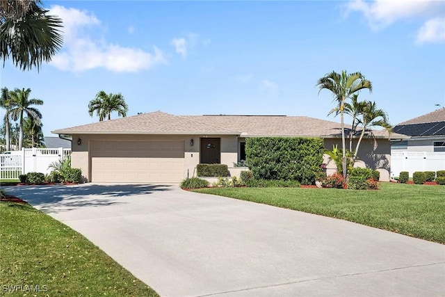 ranch-style house with concrete driveway, fence, a garage, and stucco siding