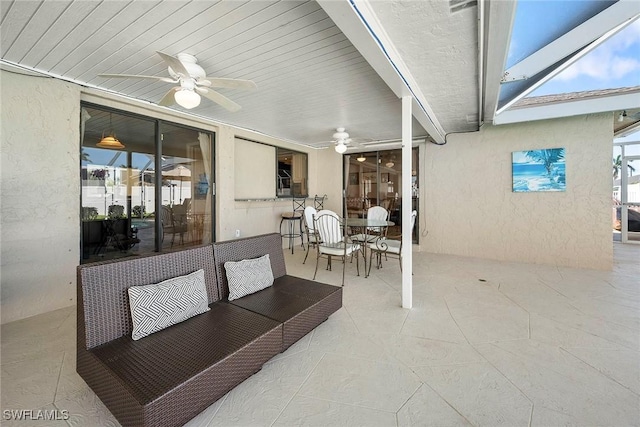 view of patio with ceiling fan