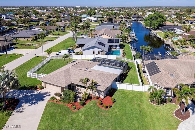 birds eye view of property featuring a residential view and a water view