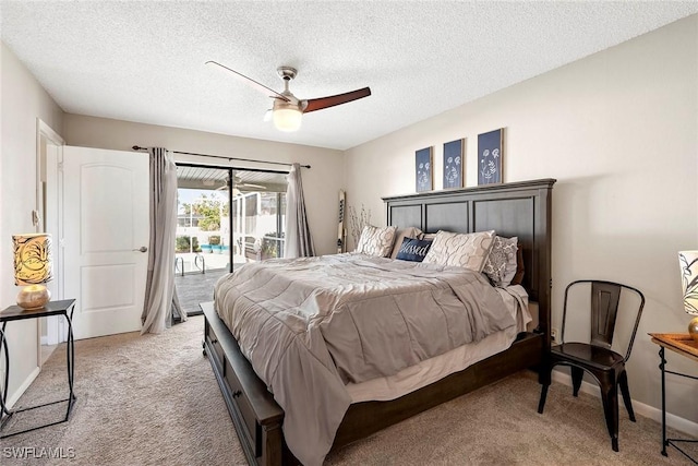 bedroom with access to exterior, light colored carpet, a textured ceiling, and a ceiling fan