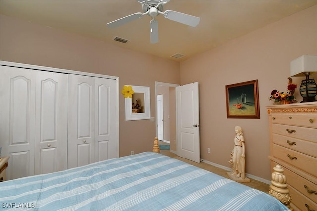 bedroom with a ceiling fan, visible vents, a closet, and baseboards