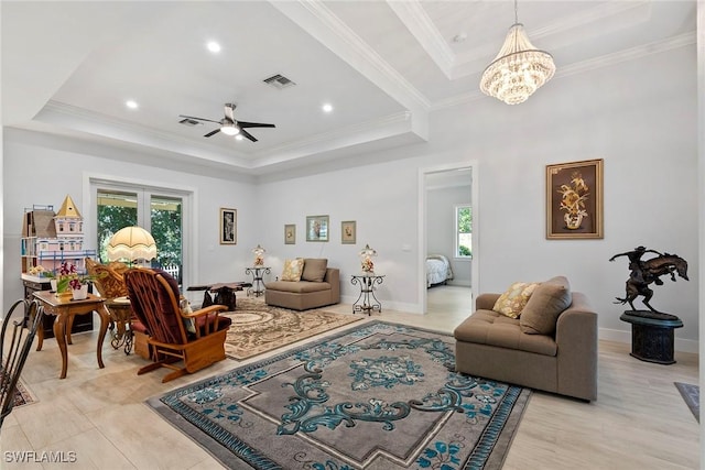 living room with visible vents, a raised ceiling, plenty of natural light, and crown molding