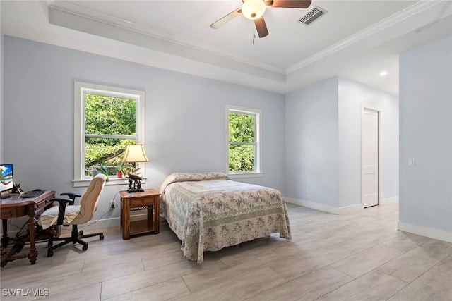 bedroom featuring multiple windows, baseboards, and visible vents