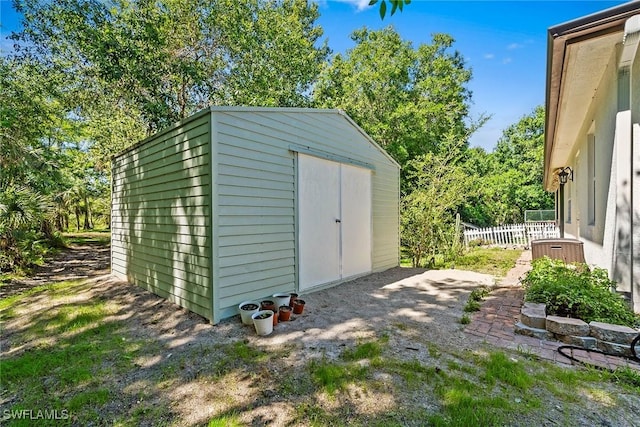 view of shed with fence