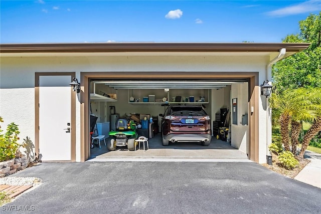 garage featuring driveway