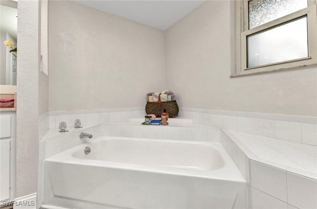 full bathroom with a garden tub