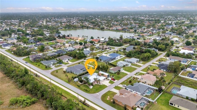 birds eye view of property featuring a residential view and a water view