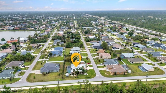 aerial view featuring a residential view and a water view