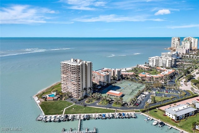 drone / aerial view featuring a water view and a view of city