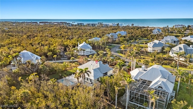 drone / aerial view with a residential view and a water view