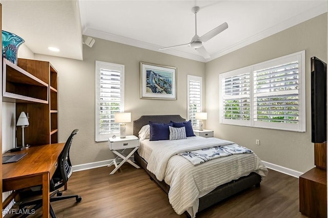 bedroom featuring baseboards, a ceiling fan, dark wood-style floors, and crown molding