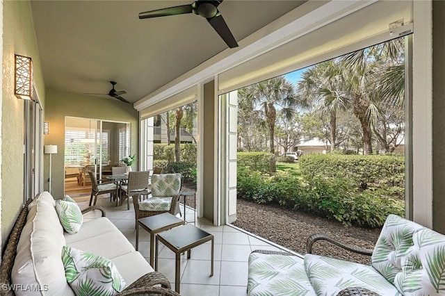 sunroom / solarium with a ceiling fan