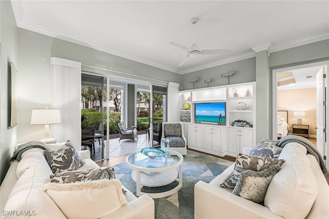 living room with a ceiling fan, wood finished floors, and crown molding