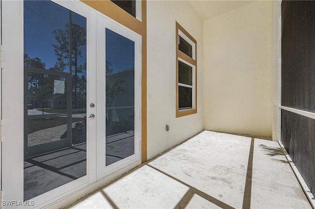 balcony with french doors and a patio