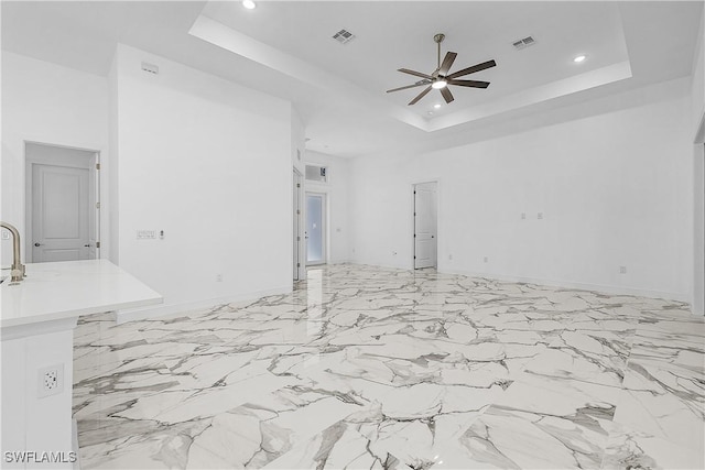 garage with a ceiling fan, recessed lighting, visible vents, and baseboards