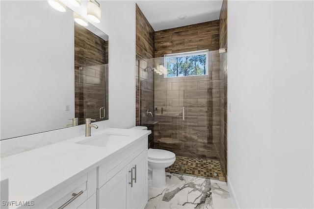 full bath with toilet, marble finish floor, a shower stall, baseboards, and vanity
