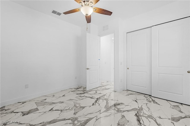 unfurnished bedroom with a closet, visible vents, a ceiling fan, and baseboards