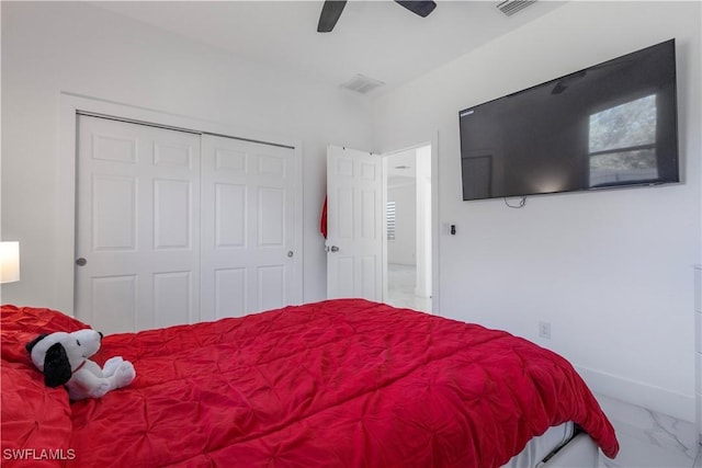 bedroom with a ceiling fan, visible vents, baseboards, a closet, and marble finish floor