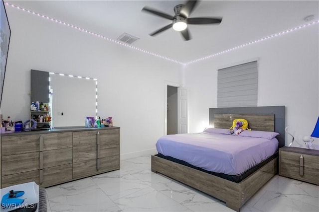 bedroom with visible vents, marble finish floor, baseboards, and ceiling fan