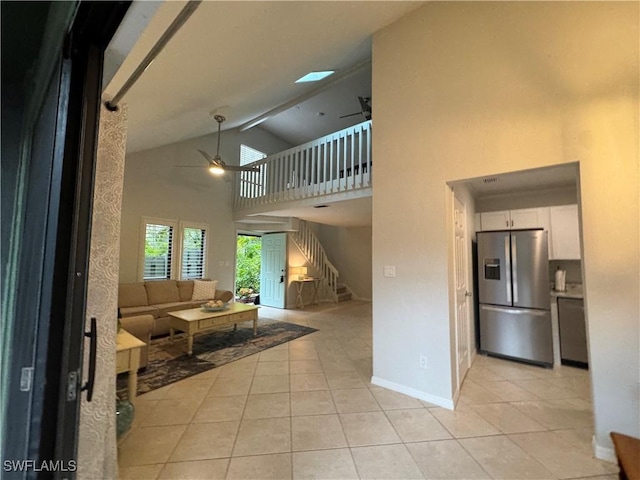 1281 Solana Rd, Naples, FL 34103 - living area with light tile patterned flooring, baseboards, stairs, and a ceiling fan