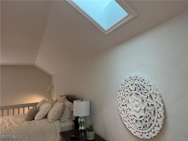 1281 Solana Rd, Naples, FL 34103 - bedroom with lofted ceiling with skylight and a textured wall