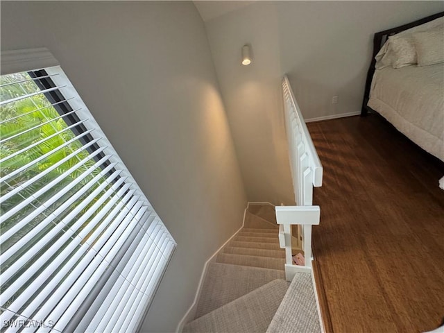1281 Solana Rd, Naples, FL 34103 - stairway with baseboards and wood finished floors