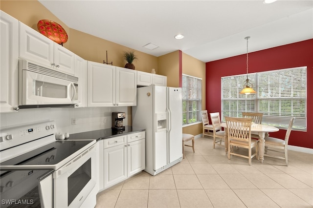 kitchen featuring dark countertops, decorative light fixtures, decorative backsplash, white appliances, and white cabinetry