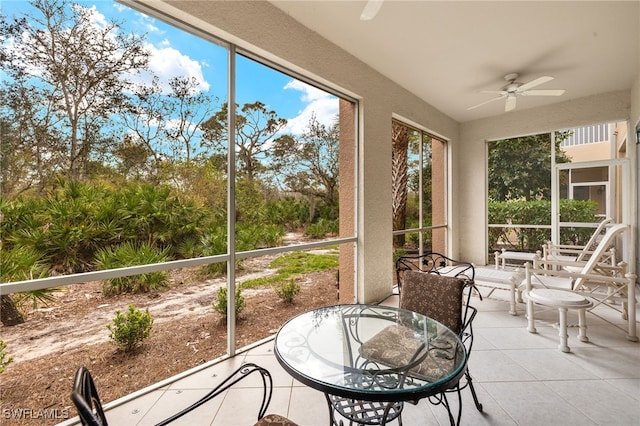 sunroom with a ceiling fan