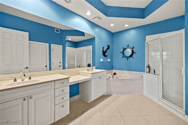 bathroom featuring tile patterned flooring, visible vents, a shower stall, and vanity