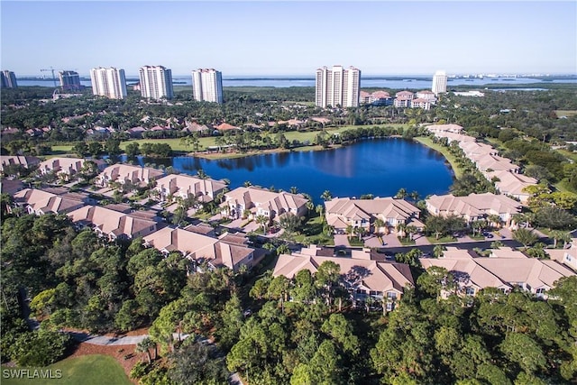 birds eye view of property featuring a view of city, a water view, and a residential view