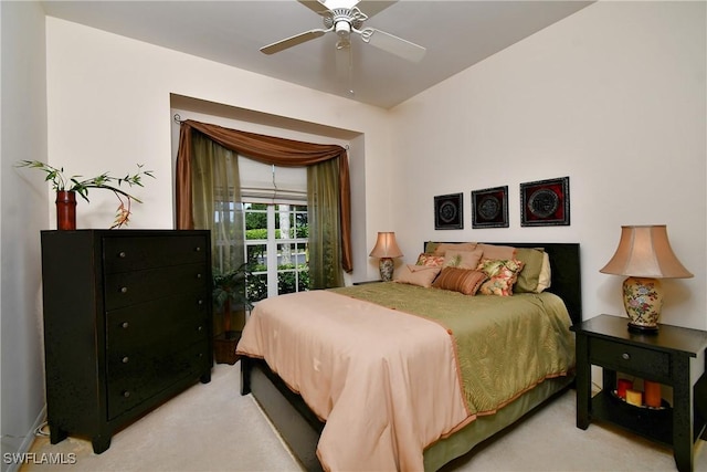 bedroom with a ceiling fan and light carpet